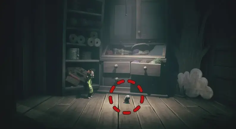 Hidden room behind bookcase with doll