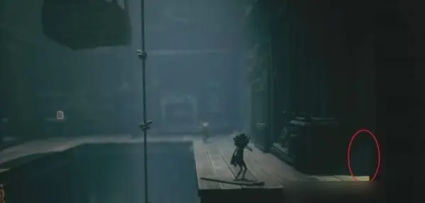 Scaring nome near chair in Little Nightmares 3 Carnival